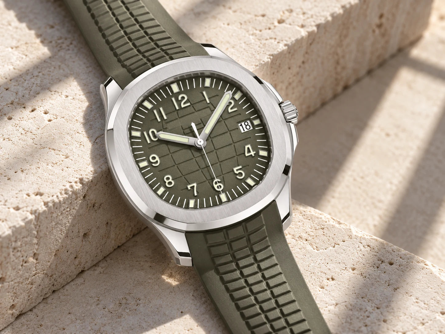 Olive watch on pale limestone